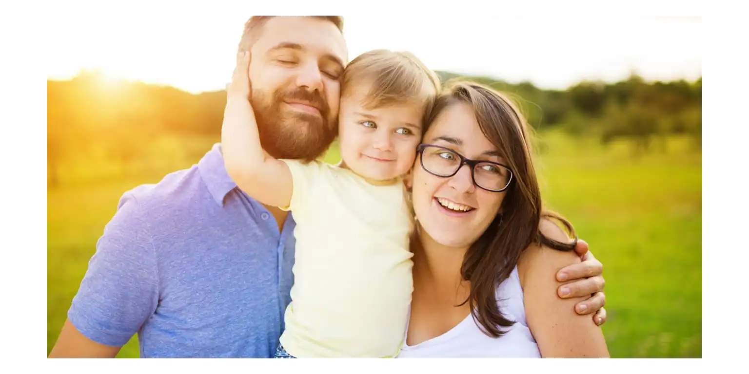 happy parents and a happy child are nearby